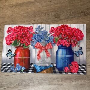 Charming Floral Door Mat with Red and Blue Jars